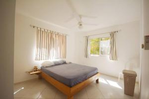 En eller flere senge i et værelse på Proche de tout, joli appartement