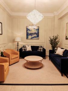a living room with a couch and a table at Frederick House Hotel in Edinburgh