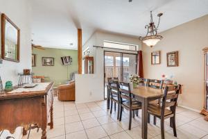 a kitchen and dining room with a table and chairs at Lake Havasu City Duplex about 1 Mi to London Bridge! in Lake Havasu City