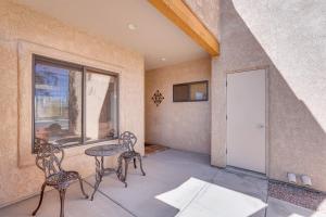 a room with a table and chairs and a window at Lake Havasu City Duplex about 1 Mi to London Bridge! in Lake Havasu City