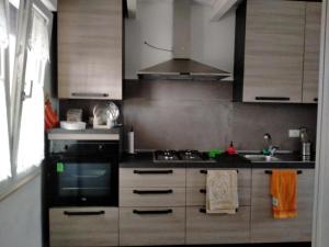 a kitchen with a stove and a sink at Villa Cecilia in Scerni