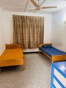 Ένα ή περισσότερα κρεβάτια σε δωμάτιο στο Ceylon Glory Hostel