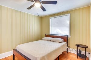 a bedroom with a bed and a ceiling fan at Augusta Home with Fenced Yard - 4 Mi to Downtown! in Augusta