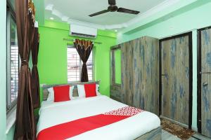 Katil atau katil-katil dalam bilik di OYO Sradhanjali Guest House