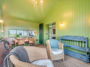 a living room with chairs and a dining room at Beiras Garden, Knockendoch in New Abbey