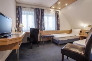 TV a/nebo společenská místnost v ubytování Hotel Krone
