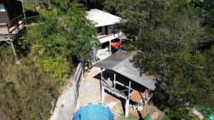 an overhead view of a house in the trees at el paraiso de juanjo in San Carlos