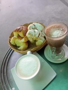 a basket of pastries and a cup of coffee on a table at Residencial Shalom in Cafayate