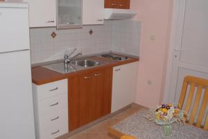 Kuchyň nebo kuchyňský kout v ubytování Apartments Skalin