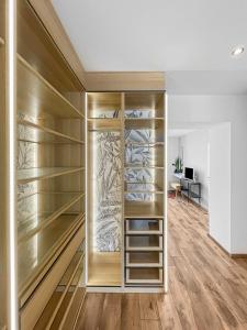 a walk in closet with wooden shelves at Escapade Authentique in Aubange