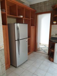 a kitchen with a white refrigerator in a room at Vacation villa in Sharm El Sheikh on the beach in Sharm El Sheikh