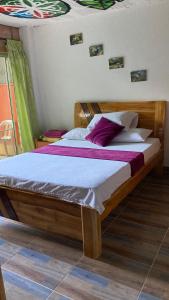 Postel nebo postele na pokoji v ubytování Hostal Vista Hermosa