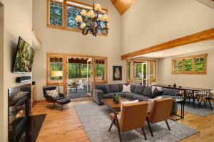 a living room with a couch and a table at All-Season Suncadia Home Hot Tub and Heated Patio in Cle Elum
