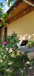 a bed in the yard of a house at 7 Garden Bungalow / Camping in Kumluca