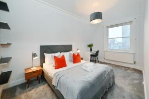 Giường trong phòng chung tại London Choice Apartments - Baker Street- Regent's Park