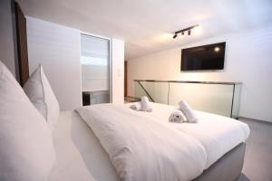 Katil atau katil-katil dalam bilik di JAM Apartments