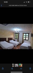 Кровать или кровати в номере Hotel El Mirador Anexo 1