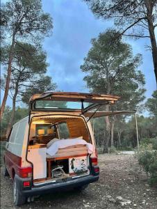 a van with its door open with its roof open at Van Camper Ibiza Volkswagen T4 Van Voyage in Ibiza Town