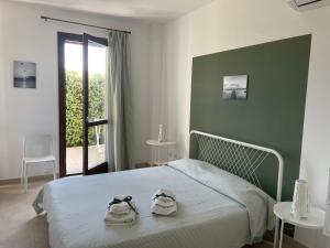 A bed or beds in a room at Aquilone Garden