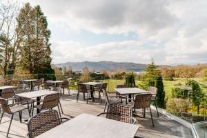 a patio with tables and chairs on a deck at Craig Manor in Bowness-on-Windermere +123 photos