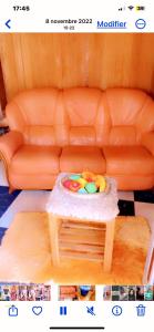 a picture of a toy couch with a table at La Fierté in Ziguinchor