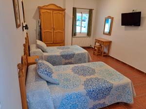Postel nebo postele na pokoji v ubytování Apartamentos Martin