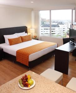 Ліжко або ліжка в номері Estelar Apartamentos Medellin