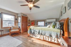 a bedroom with a bed and a ceiling fan at Cozy Clear Lake Home - Walk to Town and Boat Dock! in Clear Lake