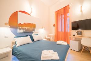 Postel nebo postele na pokoji v ubytování Sunscape Rooms Cagliari City Center