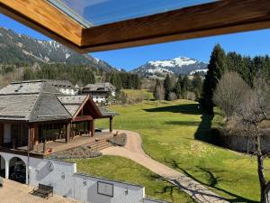 a view of the golf course from the house at TURM KAPS Luxury home direkt am Golfplatz by Belle Stay in Kitzbühel