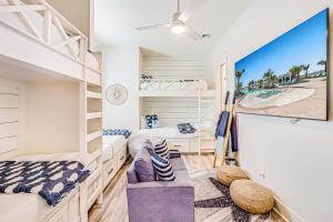 a bedroom with two bunk beds and a desk at Palmilla Beach Beauty in Port Aransas +56 photos