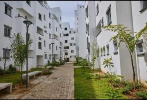 an empty street in front of a building at Buxton point apartment in Mombasa