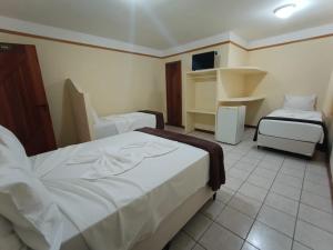 Postel nebo postele na pokoji v ubytování Coroa Bella Praia Hotel + 26 fotografií