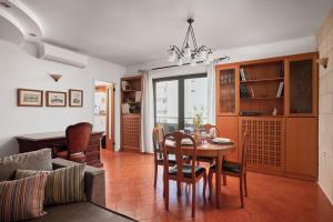 a kitchen and dining room with a table and chairs at Elegant Family Apartment with free private parking in Heraklio