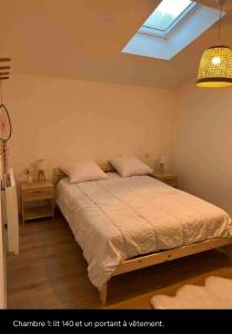 Llit o llits en una habitació de Le Refuge du Cagire