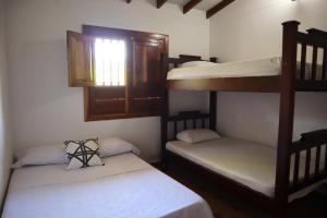 Postel nebo postele na pokoji v ubytování Villas de San Jacobo