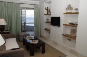 a living room with a couch and a table at LAS MAREAS in Tazacorte