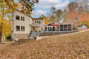 a house with a large yard in front of it at Cheerful Lake Wylie Home with Fire Pit! in Charlotte
