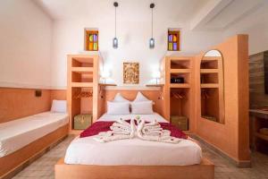 Postel nebo postele na pokoji v ubytování Riad Ambre et Jasmin
