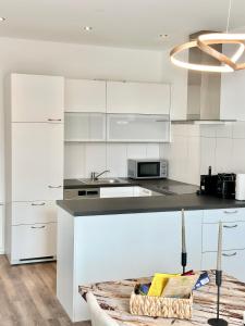 Kuchyň nebo kuchyňský kout v ubytování Wohnen deluxe mit Pfänderblick