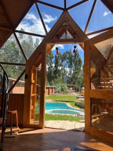 an inside view of a house with a swimming pool at Domos lujosos, completos y privados en Cusco in Calca