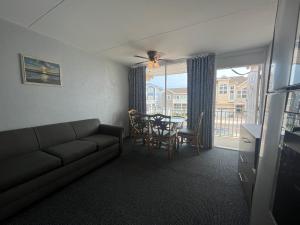 a living room with a couch and a table at Granada Ocean Resort in Wildwood Crest