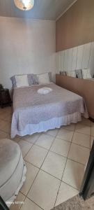Ein Bett oder Betten in einem Zimmer der Unterkunft Pousada do Farol Bar e Restaurante