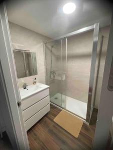 a bathroom with a shower and a white sink at Apartamento De lujo ! san juan pueblo, alicante in San Juan de Alicante