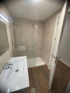 a white bathroom with a shower and a sink at Apartamento De lujo ! san juan pueblo, alicante in San Juan de Alicante