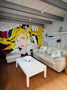 a living room with a couch and a table at Palafox in Madrid