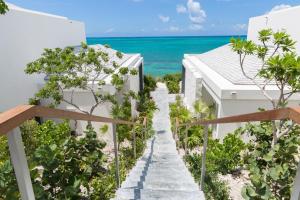 a stairway leading to the beach from a house at Rock House in Providenciales