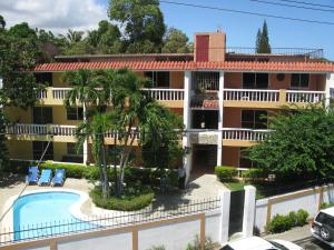 a view of a hotel with a swimming pool at Sosua Suites Condos in Sosúa