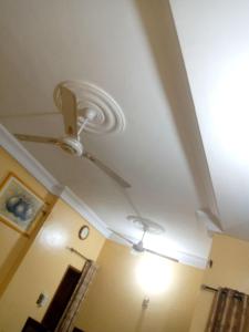 a ceiling fan in a room with a ceiling at ROYAL HOUSE INTERNATIONAL in Porto-Novo