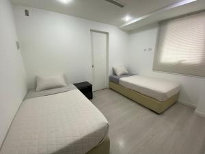 Tempat tidur dalam kamar di De lujo en la mejor zona de Caracas